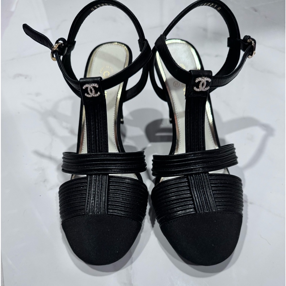 Black Chanel heels worn twice